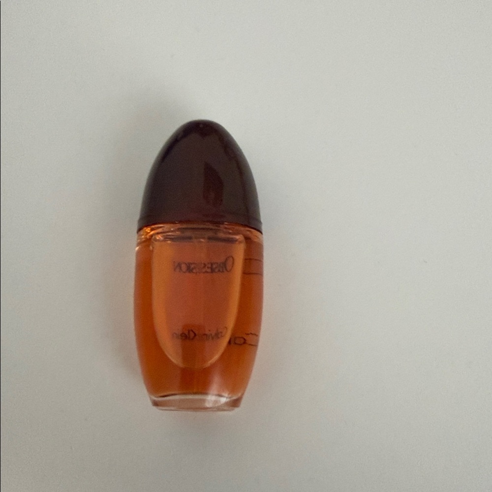 Calvin Klein Obsession Fragrance with Rich Brown and Orange Hues - Picture 2 of 4